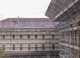 Temporary scaffold for construction works at building site photo