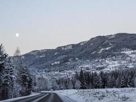 Driving at night through mountains, villages, forests in Norway. photo