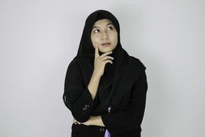 happy and daydreaming gesture Young Asian Islam woman wearing headscarf. photo