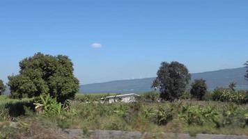 The landscape of the railway line of Thailand that passes through fields and fields and mountains and forests and rivers. video