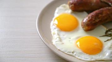homemade double fried egg with fried pork sausage - for breakfast video