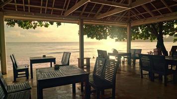 empty wooden chair with beach sea background video