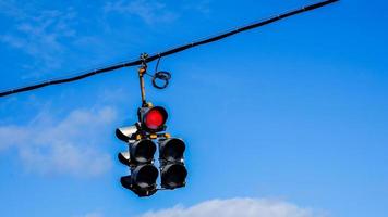 Traffic lights with blue sky and some clouds photo