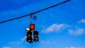 Traffic lights with blue sky and some clouds photo