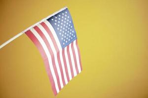 American flag on red background on yellow background photo