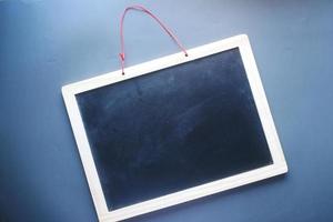 empty Black School Chalk Board on black background , photo