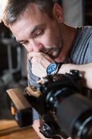 portrait of photographer with camera in Studio photo