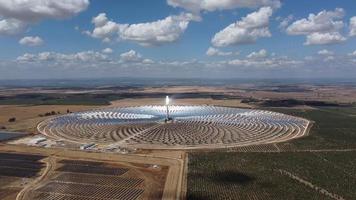 Aerial drone view of Gemasolar Thermosolar Plant in Seville, Spain. Solar energy. Green energy. Alternatives to fossil fuel. Environmentally friendly. Concentrated solar power plant. Renewable energy.