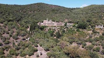 Aerial drone view of Monastery of San Jeronimo de Valparaiso in Cordoba, Spain. Nestling in the mountains of Cordoba and surrounded by native Mediterranean vegetation, stands this impressive monastery