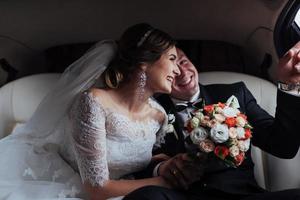 Happy man and woman smiling rejoicing in wedding day photo