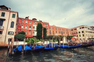 City landscape. Green water with gondolas and colorful facades o photo