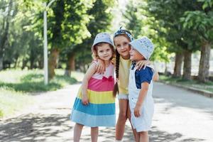 Lovely cute kids playing in the park a beautiful summer photo