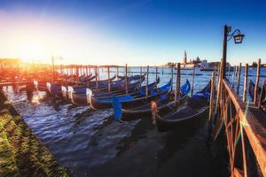 City landscape. Fantastic views of the gondola at sunset, moored photo