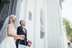 Happy young couple poses for photographers on her happiest day. photo