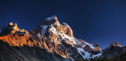 Fantastic scenery and snowy peaks in the first morning sunlight. photo