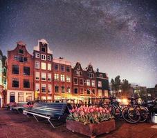 Fantastic starry sky at night in Amsterdam. Beautiful illuminati