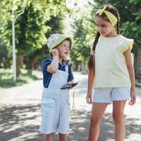 Cute girl and boy listening to music photo