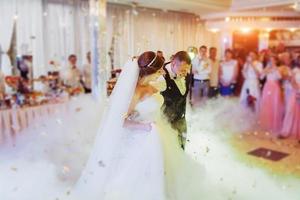 Happy bride and groom their first dance photo