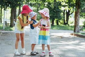 Cute girl and boy listening to music photo