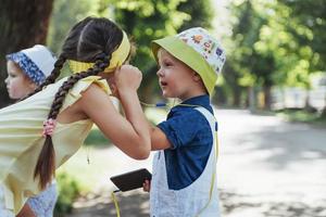 Cute girl and boy listening to music photo