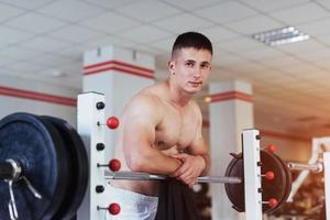 Beautiful man with big muscles, posing for the camera photo