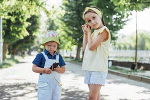 Cute girl and boy listening to music photo