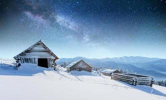 chalets in the mountains at night under the stars. Carpathians, photo