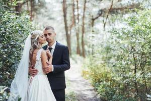 Happy young couple poses for photographers on her happiest day. photo