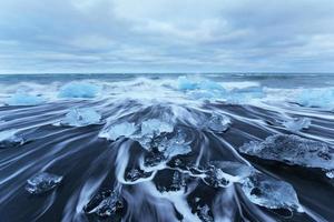 Jokulsarlon glacier lagoon, fantastic sunset on the black beach, photo