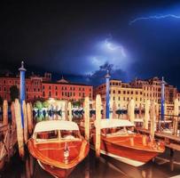 Exciting sky with lightning. The water from boats photo