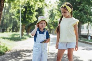 Cute girl and boy listening to music photo