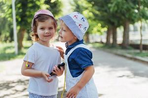 portrait of a little girl and her brother. photo