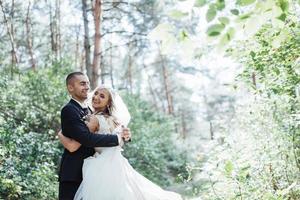 groom at a park on their wedding day photo