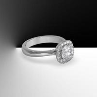 white gold halo engagement ring with round center stone and plain shank cathedral style 3d render photo