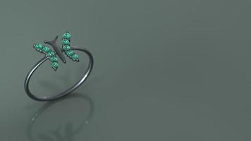 butterfly ring in black gold and emerald color stone 3d render photo