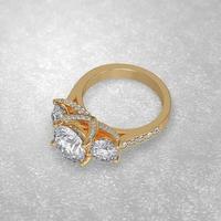 3 stone engagement ring laying down position in yellow gold 3D render photo