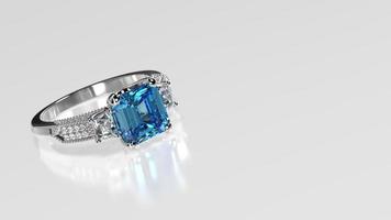 blue topaz emerald cut three stone ring in white metal photo