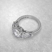 3 stone engagement ring laying down position in white gold 3D render photo