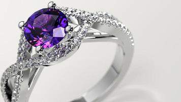 closeup shot with amethyst solitaire criss cross engagement ring photo