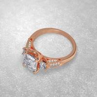 3 stone engagement ring laying down position in rose gold 3D render photo