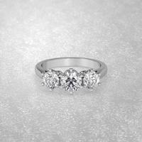 3 stone engagement ring laying down position in white gold 3D render photo