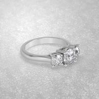 3 stone engagement ring laying down position in white gold 3D render photo