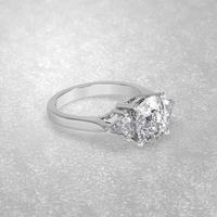 3 stone engagement ring laying down position in white gold 3D render photo