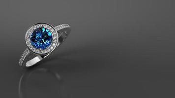 anillo de compromiso de diamantes de zafiro azul en color oro blanco foto