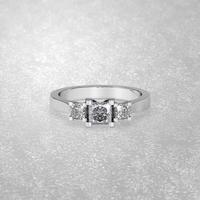 3 stone engagement ring laying down position in white gold 3D render photo