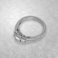 3 stone engagement ring laying down position in white gold 3D render photo