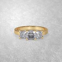 3 stone engagement ring laying down position in yellow gold 3D render photo