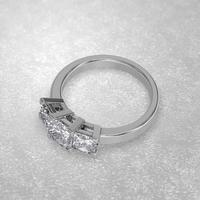 3 stone engagement ring laying down position in white gold 3D render photo