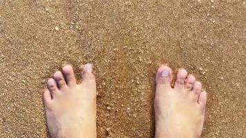 Soft waves on the beach with foot video