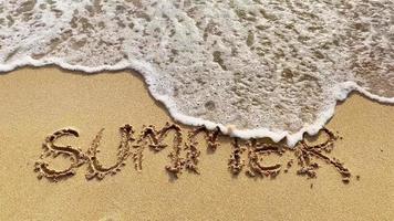 Soft waves on the beach with summer text video